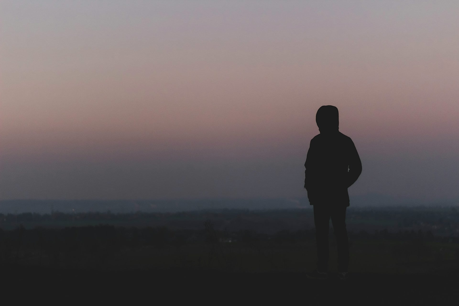 Silhouette of a person at dusk representing emotional disconnection